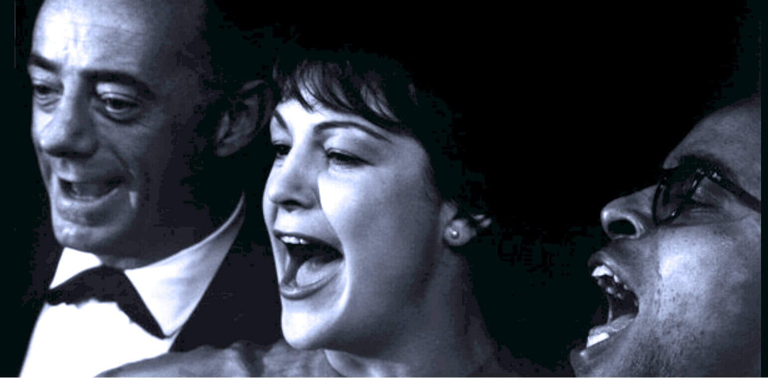 Vintage black and white photo of three jazz singers passionately performing, capturing the essence of classic music history.