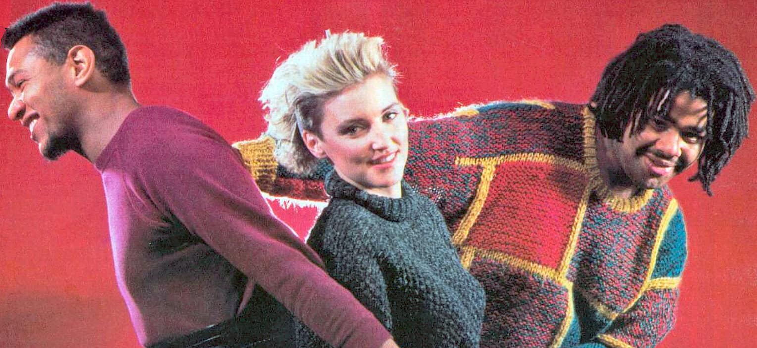 Youthful diverse group of friends smiling and having fun, casual fashion, bright red background, vibrant colors, expressing friendship and joy, social gathering, lifestyle photography.