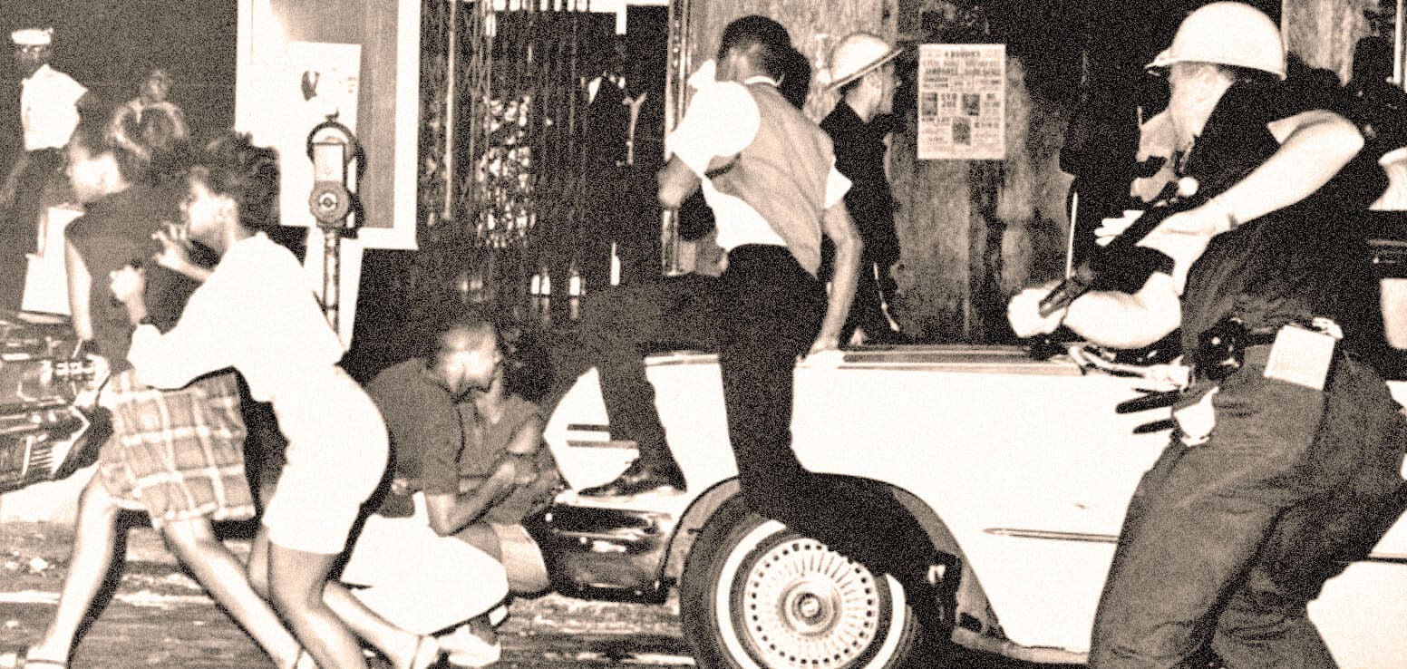 A black and white photo capturing an emergency scene with police officers, a person on the ground, and a vintage car, highlighting historical moments of law enforcement and public safety.