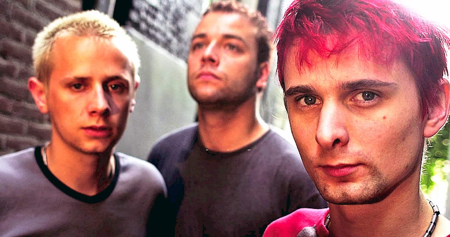 Teenage band members with vibrant hair styles, standing outdoors in an urban environment, capturing a moment of youth culture and music.