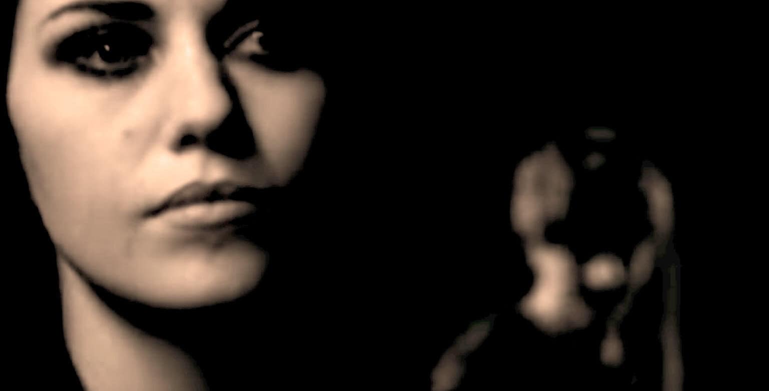 People listening to vintage music records in a dimly lit room, representing Past Daily's sound archive of news, history, and music.