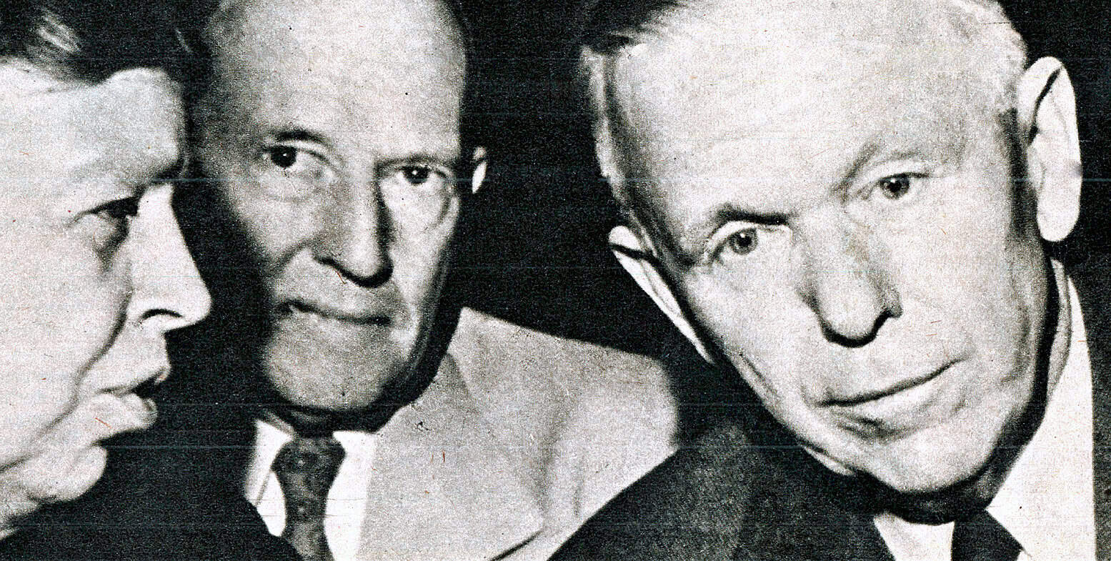 Close-up black and white photo of iconic historical figures, including John F. Kennedy, focusing on their expressions and profiles, representing mid-20th-century American politics and history.