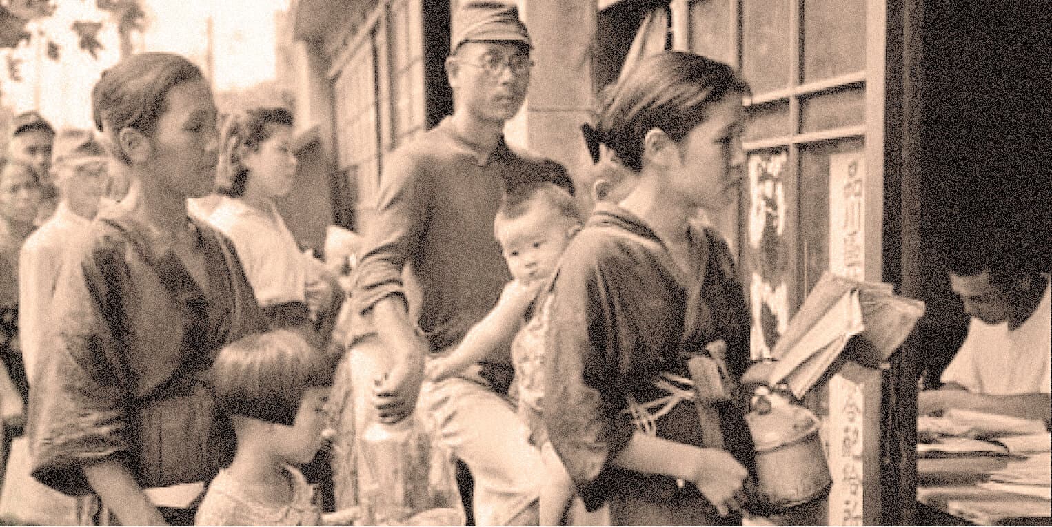 Crowd of people waiting in line at a historical food or store storefront, vintage black and white photo, capturing everyday life and social history.