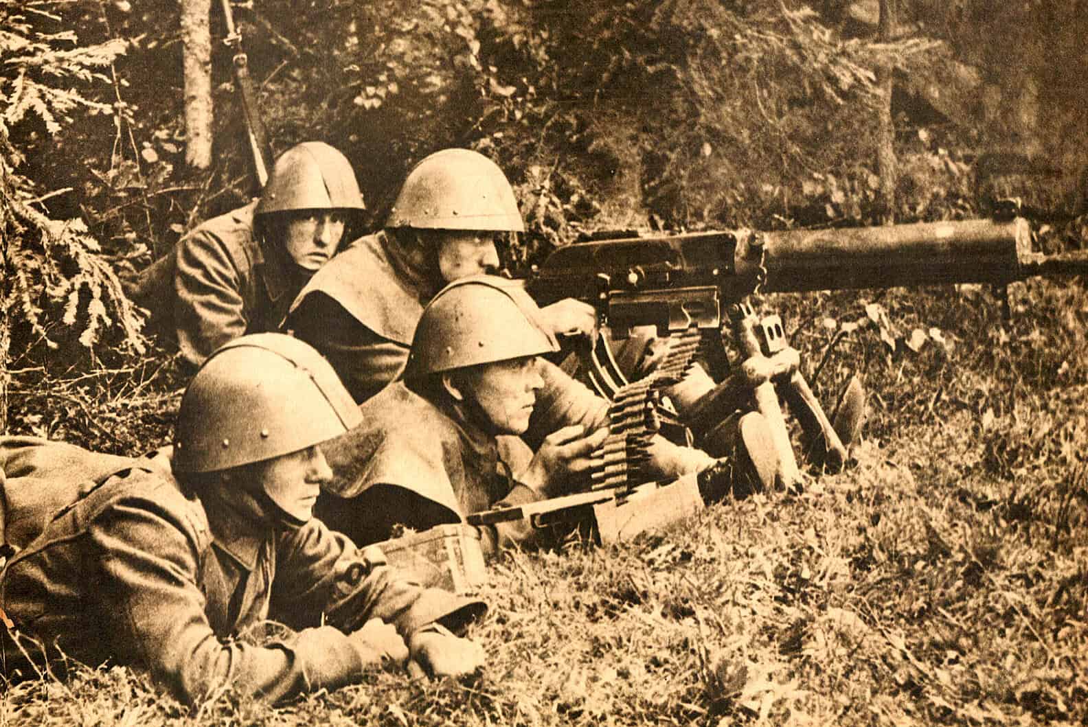 Soldiers in helmets operating a machine gun during wartime, capturing historic military moments and news archive from past daily sound recordings.