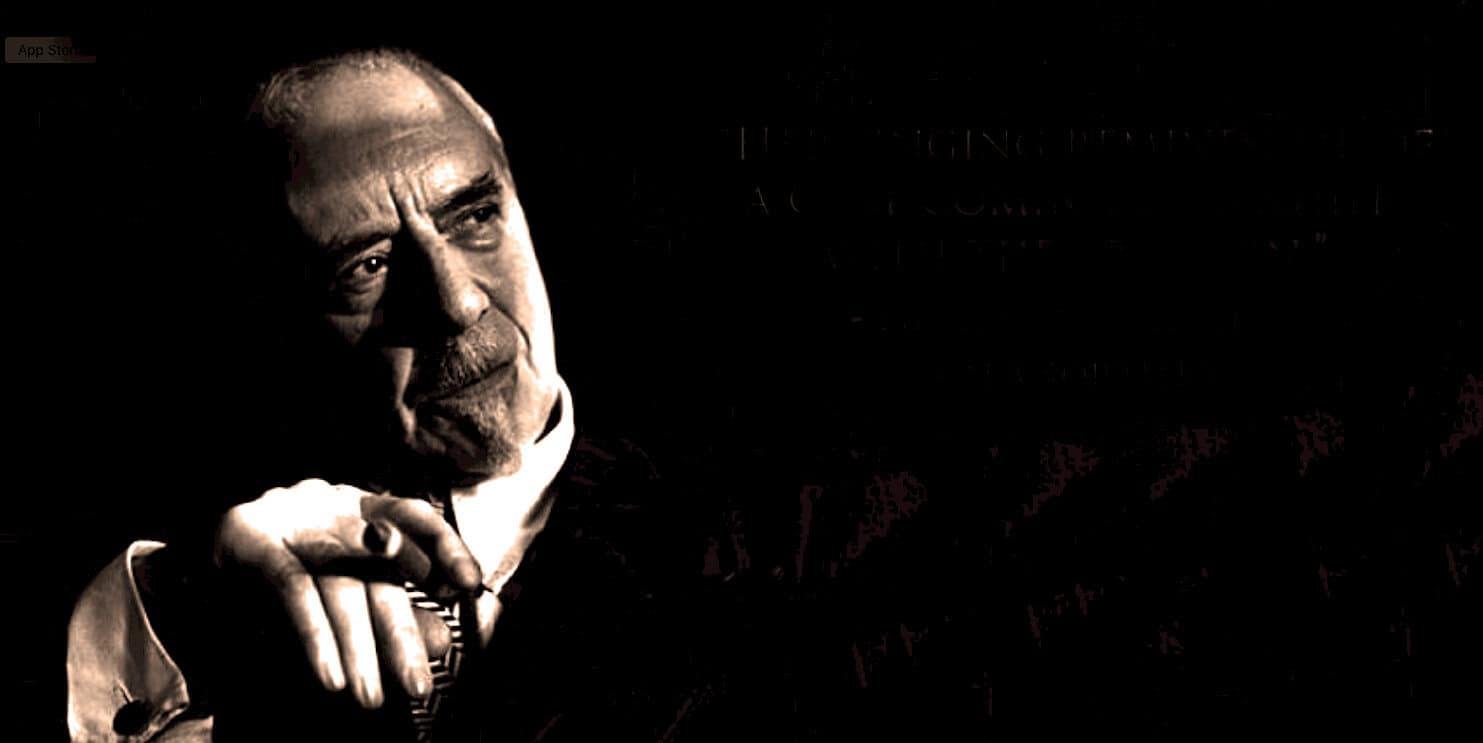 Historic black and white portrait of a distinguished older man with a thoughtful expression, wearing a suit and tie, symbolizing news, history, and music archive collection.