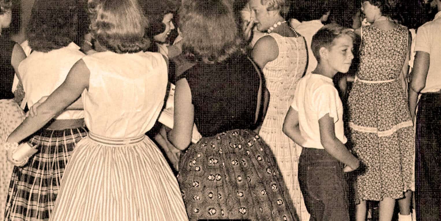 Vintage women and children in 1950s fashion, historical crowd, black and white photo, nostalgia, cultural history, past daily news archive, vintage clothing styles.