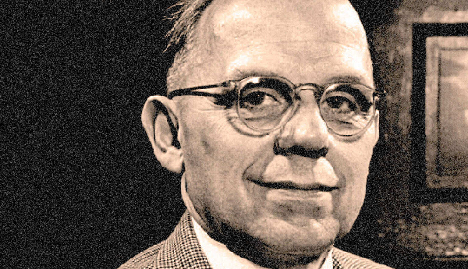Vintage black and white portrait of a scholar with glasses, representing classic news, history, and music archives from Past Daily; a sound archive of historical news and cultural recordings.