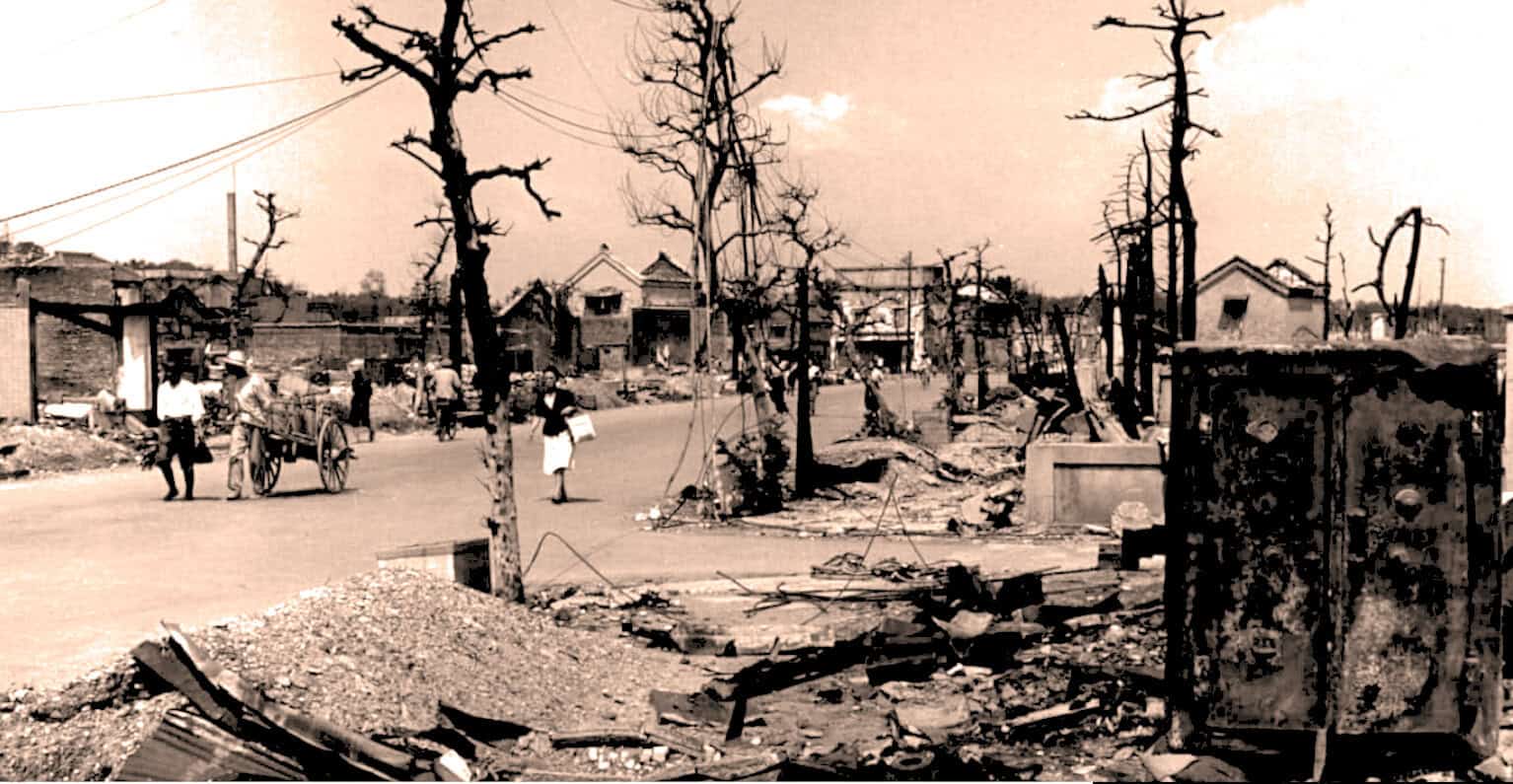 Ruined neighborhood after earthquake showing damaged trees, destroyed houses, and debris, capturing a historic disaster scene with a focus on urban destruction and resilience.
