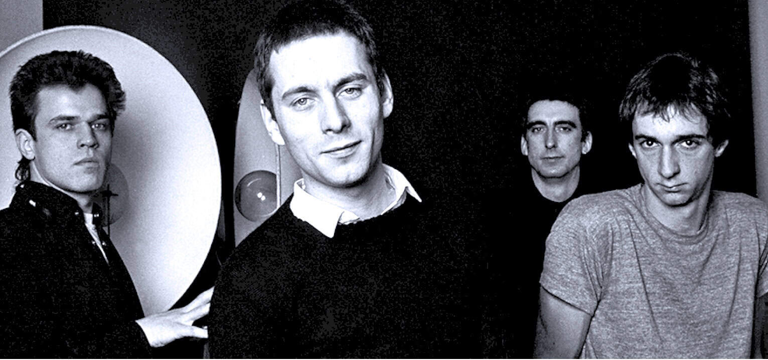 1960s iconic band members in black and white photo, music history, classic rock, vintage musicians, band photography, legendary music groups.