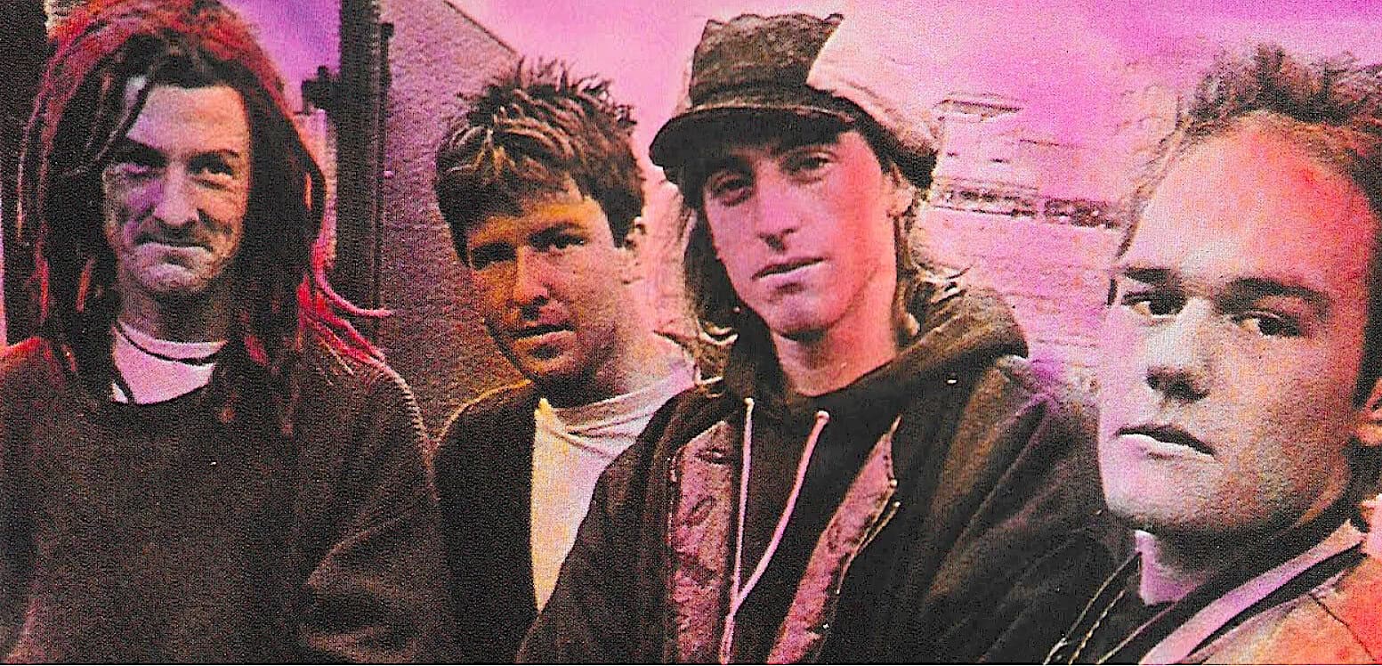 Urban youth music scene with four young men in casual attire, graffiti background, vibrant pink and purple lighting, emphasizing music, culture, and social history.