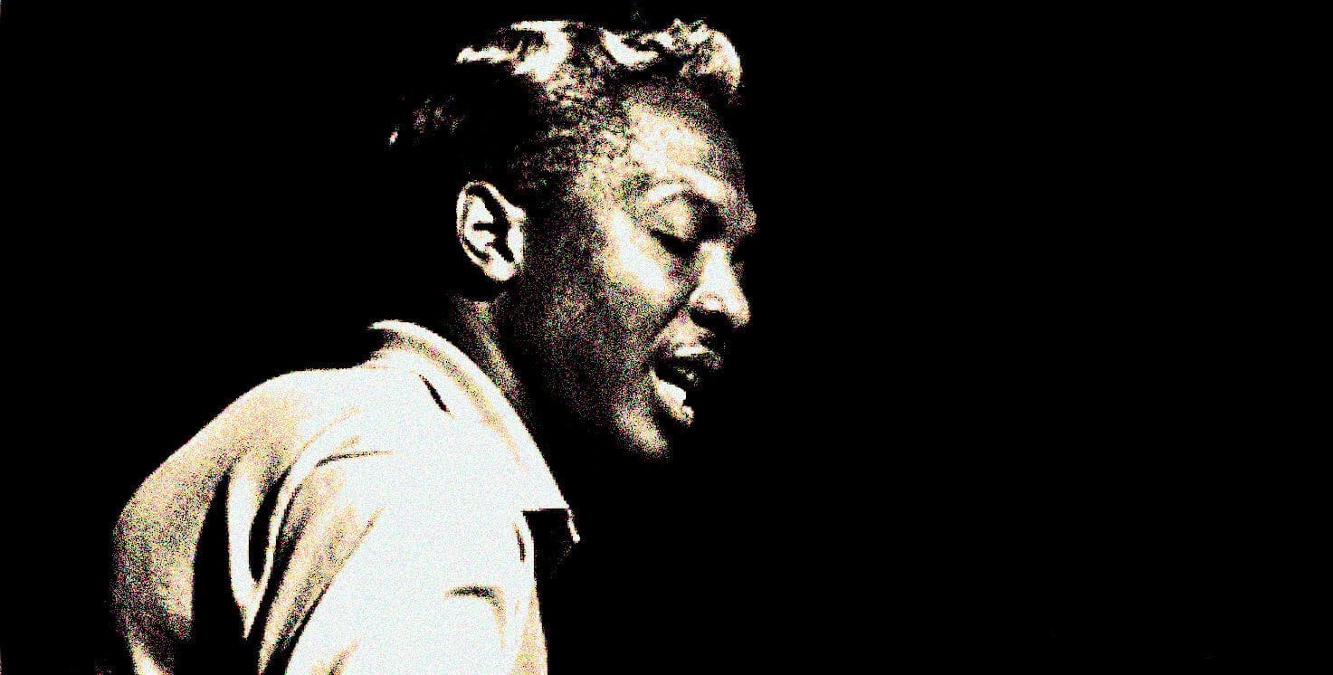 Close-up of jazz musician singing, black and white photo, expressive performance, iconic jazz artist, music and history archive, Past Daily.