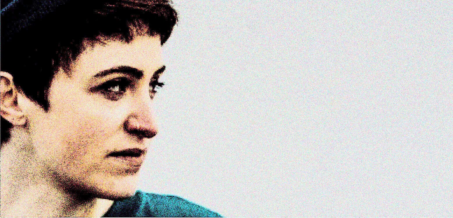 Vintage black and white photo of a young woman with short dark hair, emphasizing news, history, and music archives.