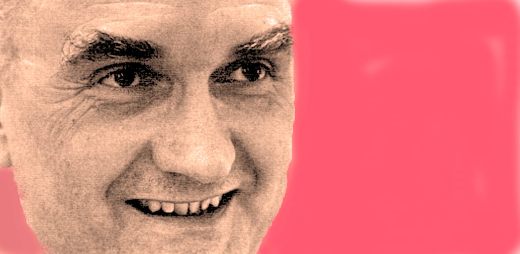 Close-up of smiling man, vintage photo style, emphasizing news, history, and music archive themes at Past Daily.