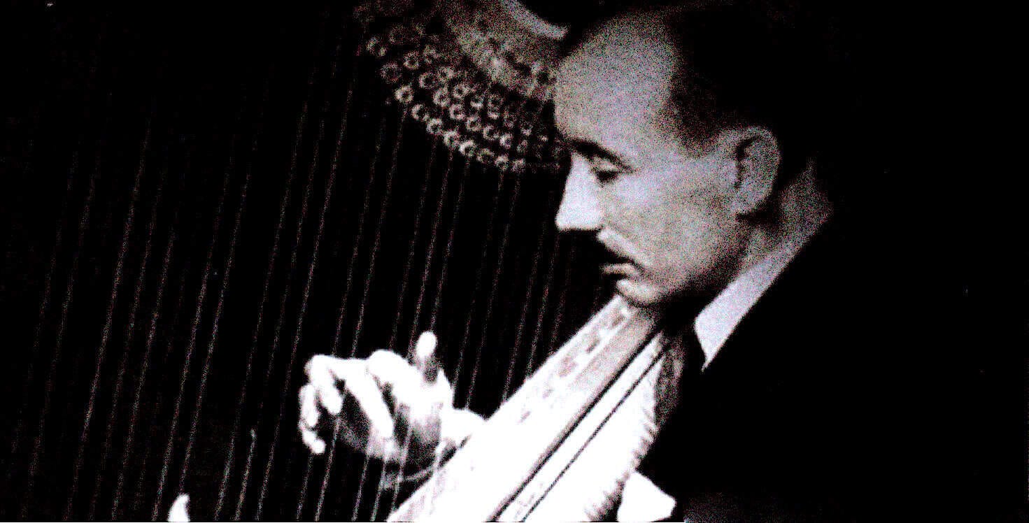 Vintage black and white photo of a man playing a vibraphone, capturing a classic jazz musician at a historic sound archive dedicated to news, history, and music recordings.