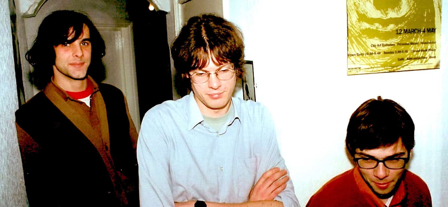 Descending, high, arts, music, event, concert, media, news, historical, archive, vintage, photograph, cultural, journalists, media footage, pastdaily, sound archive of news, history and music, legendary, photo of young musicians and journalists at an event, representing historical media content, vintage photo, media archive, music and news history, photo of young men in a media setting, related to historical sound archives, multimedia collection, radio and news memorabilia, photo of a media event.