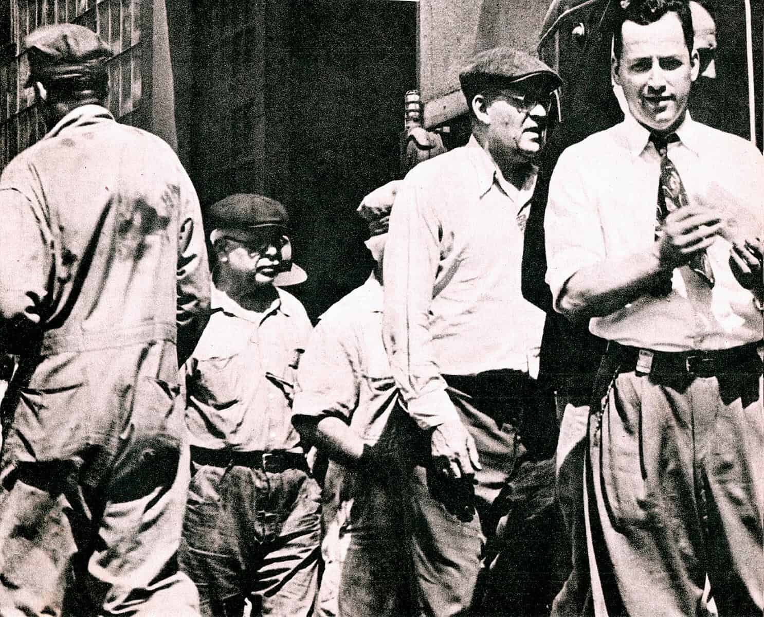Historical black and white photo of civil rights activists and protesters, capturing a moment of social activism and public gathering from the 1960s.