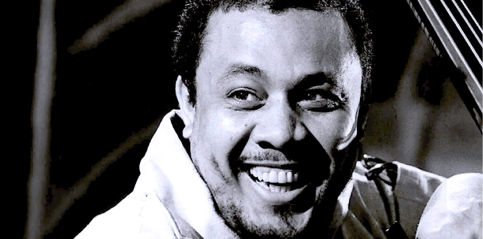 Vintage jazz musician black and white portrait, history and music archive, classic sound recordings from past daily.com, nostalgic audio news and music archive, iconic figure in music history.