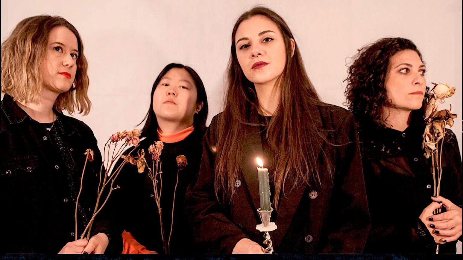 Diverse women holding dried flowers, with one woman holding a lit candle, representing music, history, and news archive themes at Past Daily.