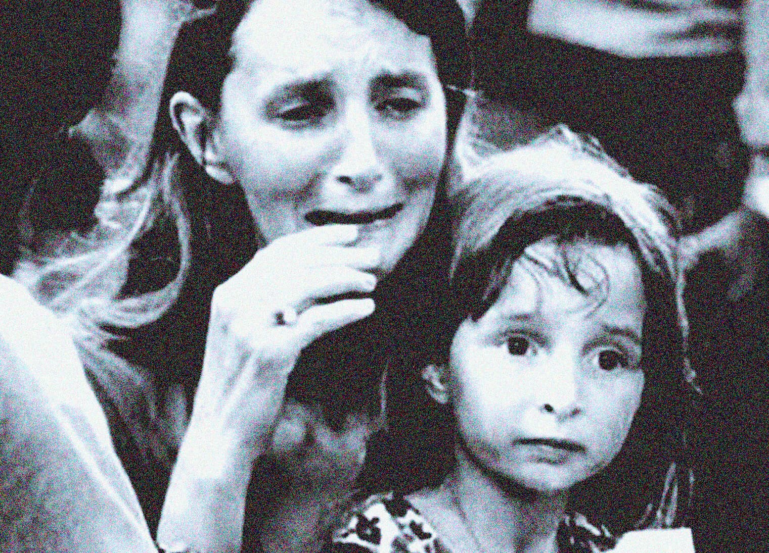 Distressed woman crying at a news event, emotional reaction, news coverage, historical news footage, human emotion, news archive, radio broadcast, media coverage, past daily, sound archive, history, music, news stories.