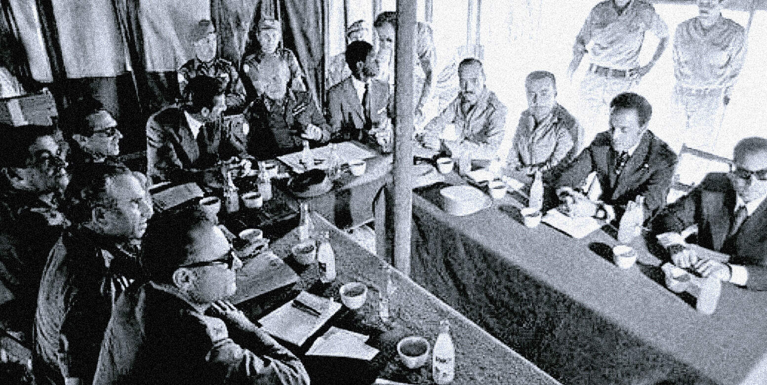Meeting of journalists discussing news and history at a traditional Asian restaurant, capturing an important moment in media archive, vintage black-and-white photo of a press conference or discussion.