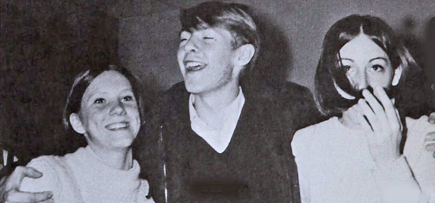 Young girl and two women enjoying music at a historic event, capturing moments of joy and celebration.