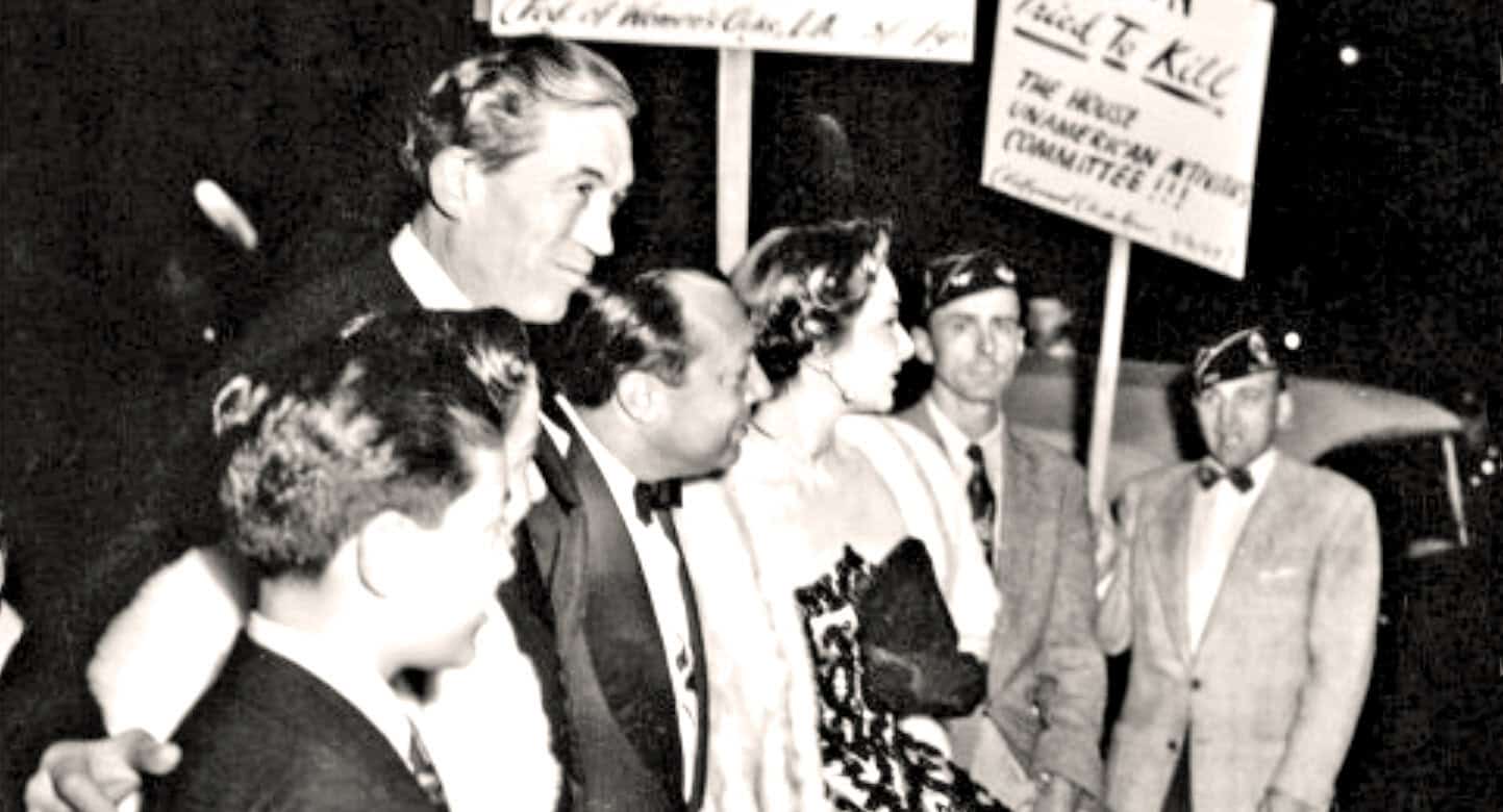 Historic news event with protesters and signs, vintage black-and-white photo, civil rights movement, social activism, 20th-century history, gathering, demonstration, social justice.