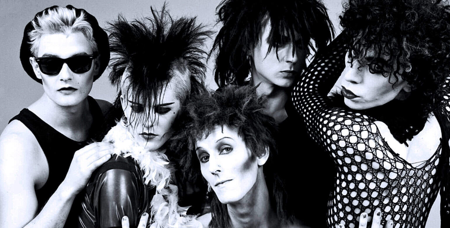 Blondie band members with punk and new wave fashion, black and white style, music history, iconic music groups, 1980s rock scene, vintage music archive, music legend, and rock band history.