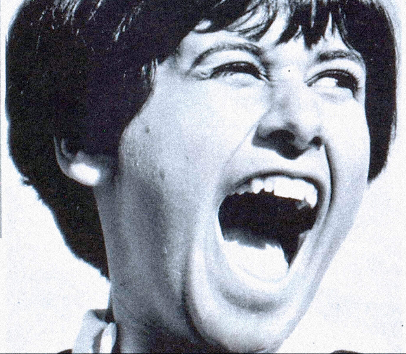 Vivid black and white portrait of Lucy from I Love Lucy, laughing heartily, showcasing classic 1950s television comedy and iconic sitcom humor.