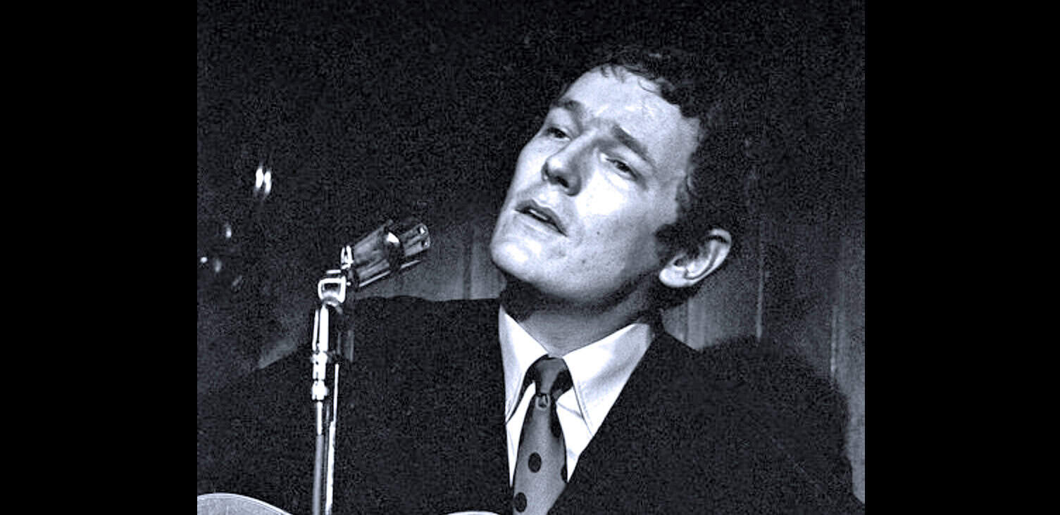 Black and white image of a classic singer performing with a microphone, capturing the essence of vintage music and entertainment history for SEO.