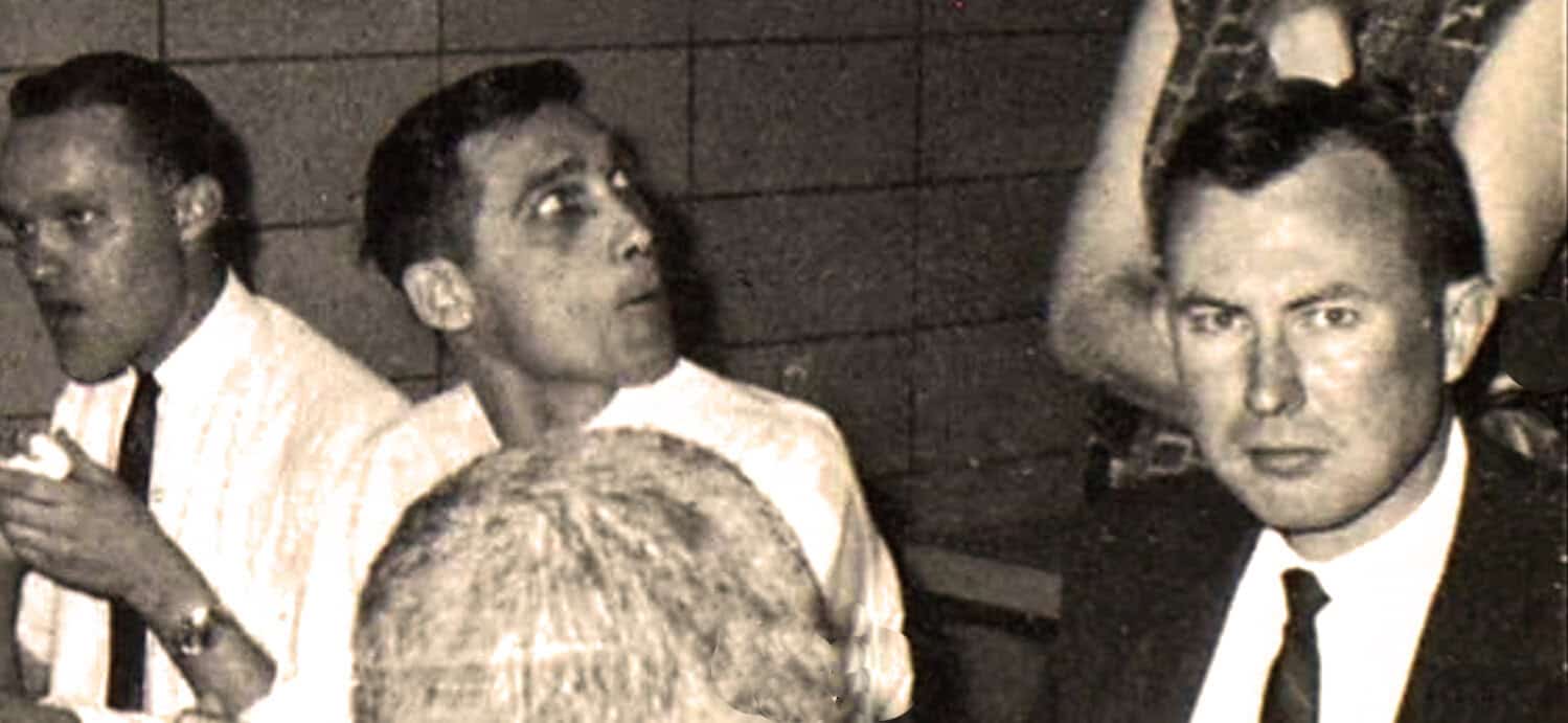 People at a historical news and music event, capturing a moment of cultural significance and vintage atmosphere.