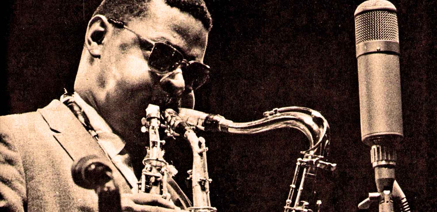 Vintage jazz saxophonist playing music into a microphone, capturing historic sounds and concerts for audio archives.