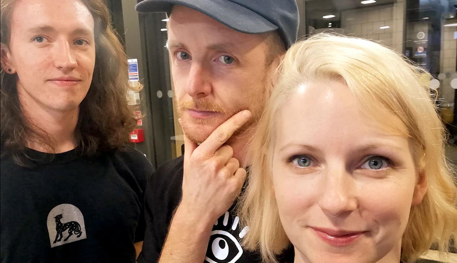 People taking selfie at night in city, friends enjoying night out, urban nightlife, smiling young adults, social gathering, casual streetwear, vibrant city background, friendship and fun, night photography, diverse group of friends.