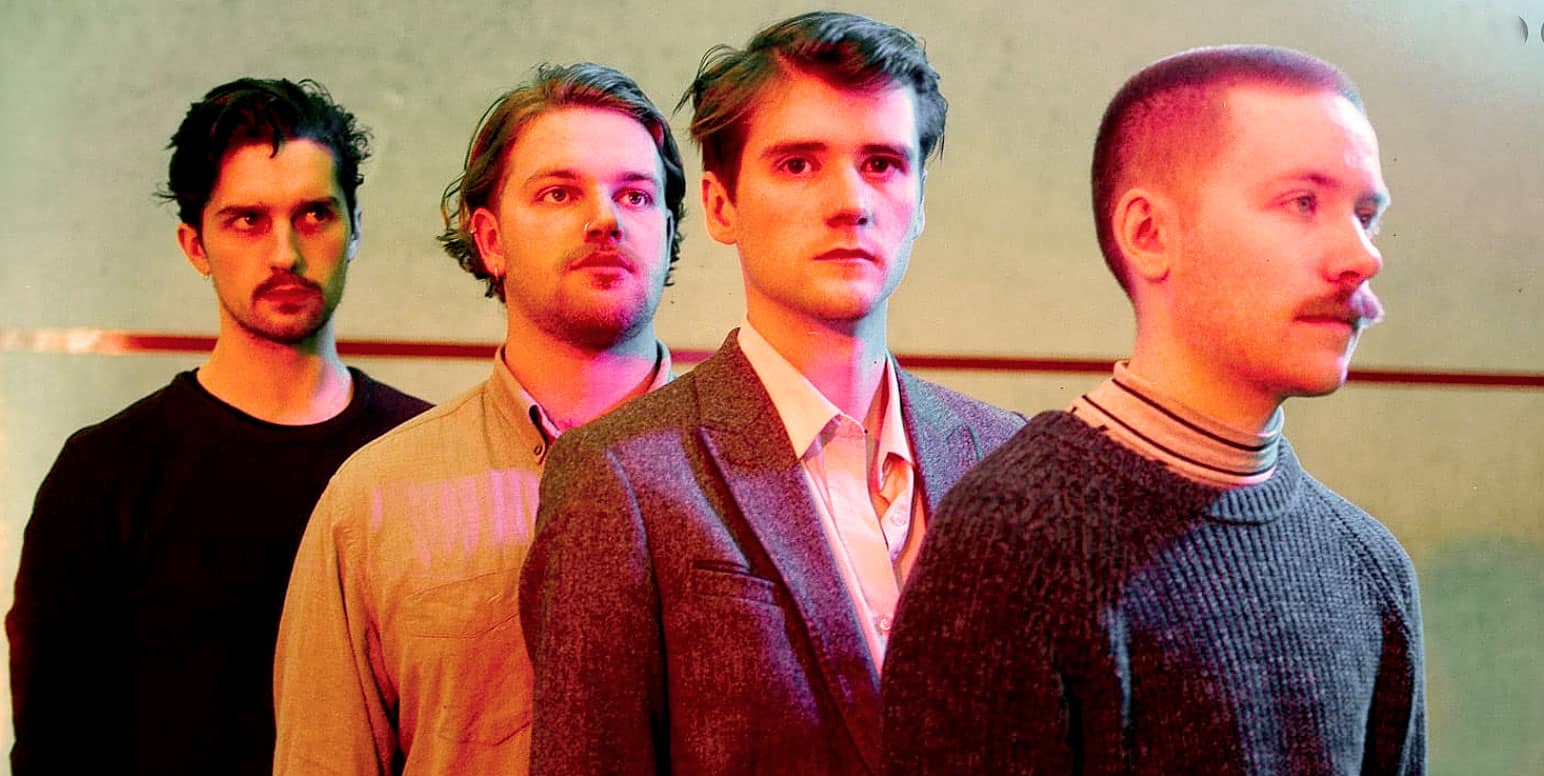 Young men standing in a line, representing music, news, and history archives on Past Daily, a sound archive of historical news, music, and events.