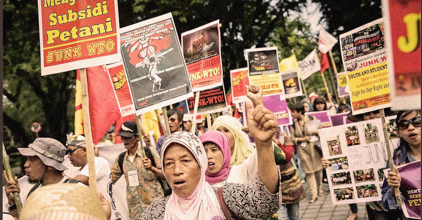 Demonstration protesting government policies, with protesters holding colorful signs and banners, showcasing activism for social and political causes.