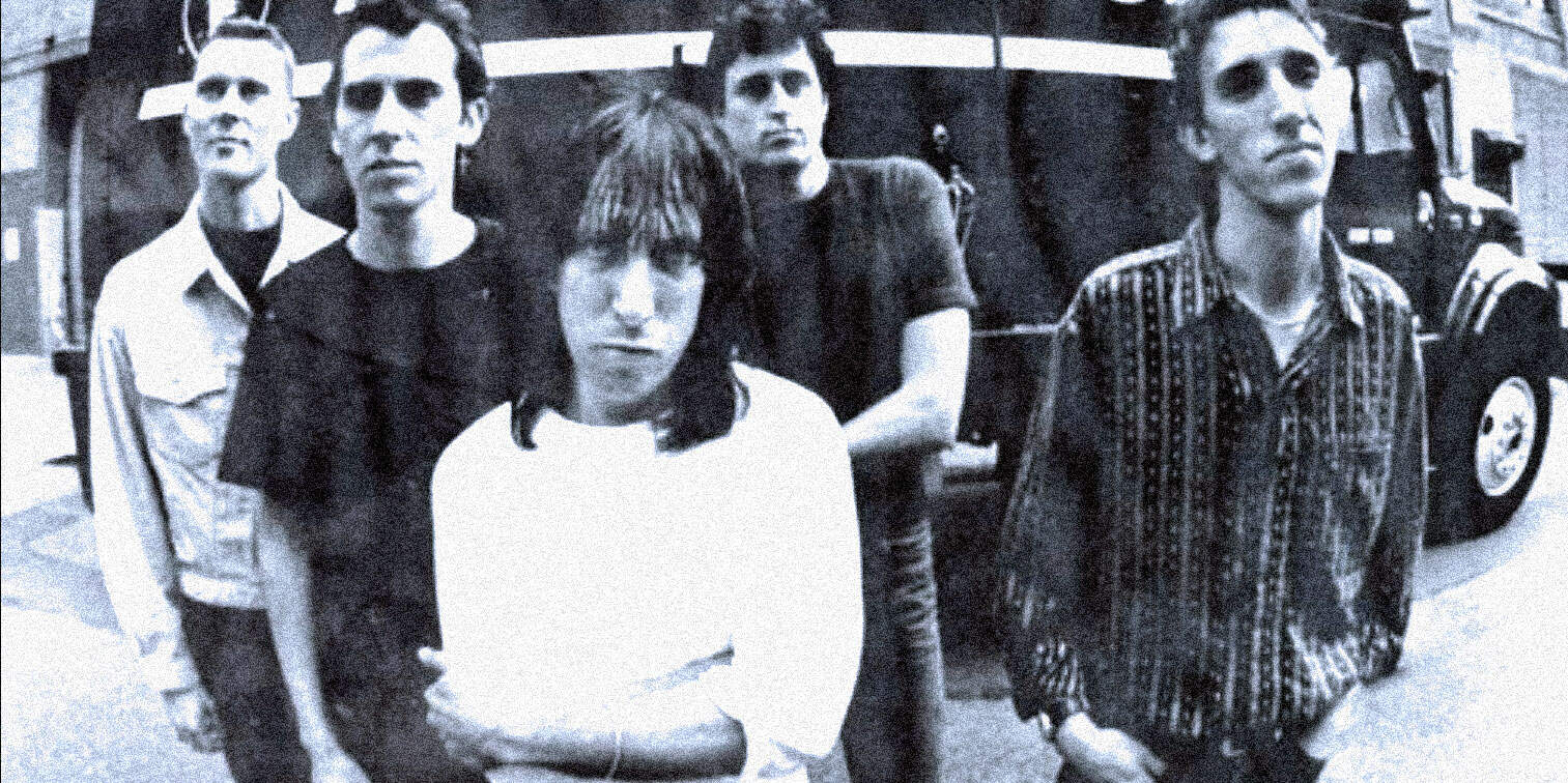 Band of young musicians in a city street, vintage photo, alternative rock, indie music, music history, urban background, black and white image.