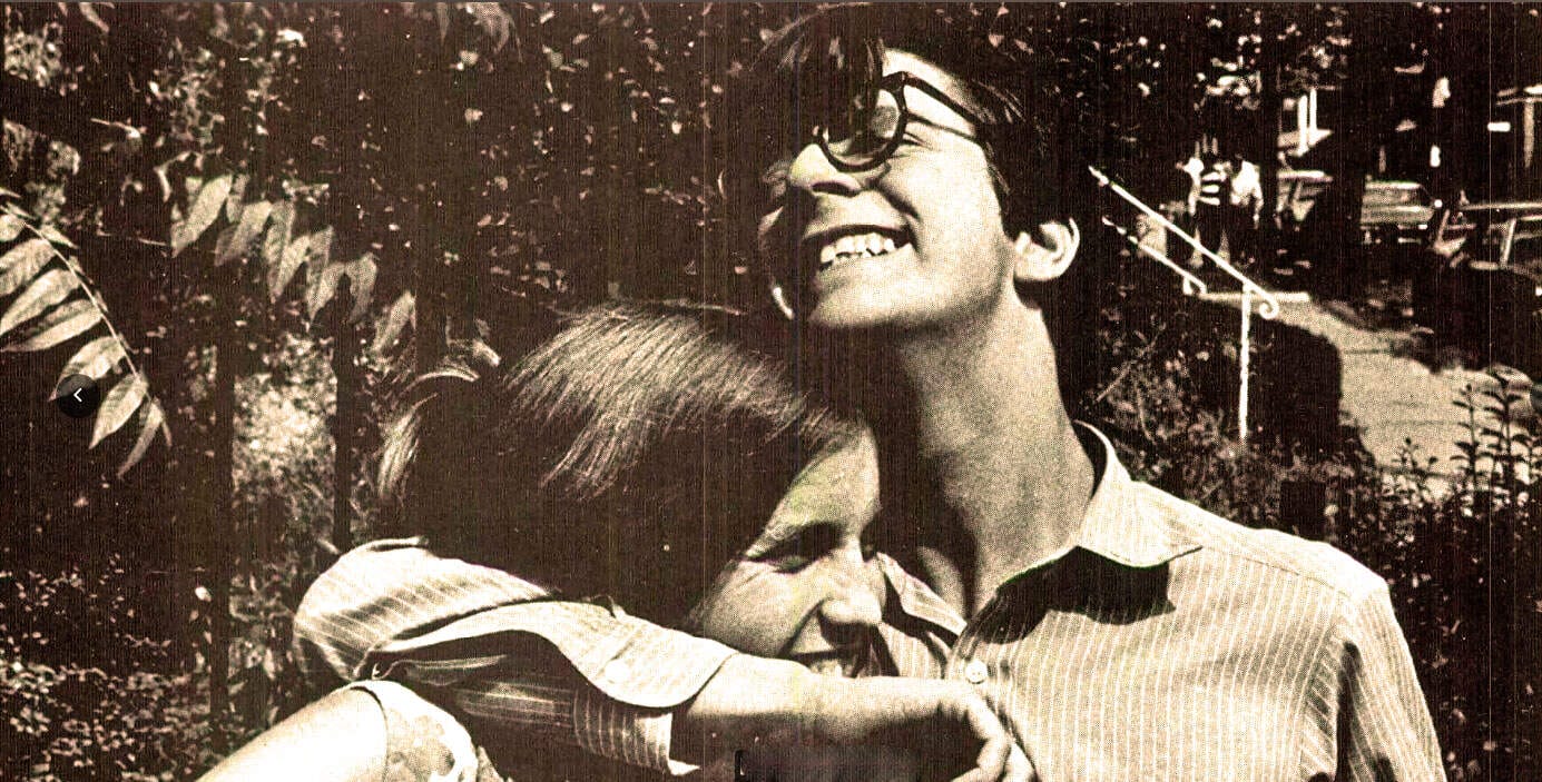 Youthful couple sharing a joyful hug outdoors, capturing a moment of happiness, love, and connection. Perfect for illustrating themes of friendship, relationships, and nostalgic moments.