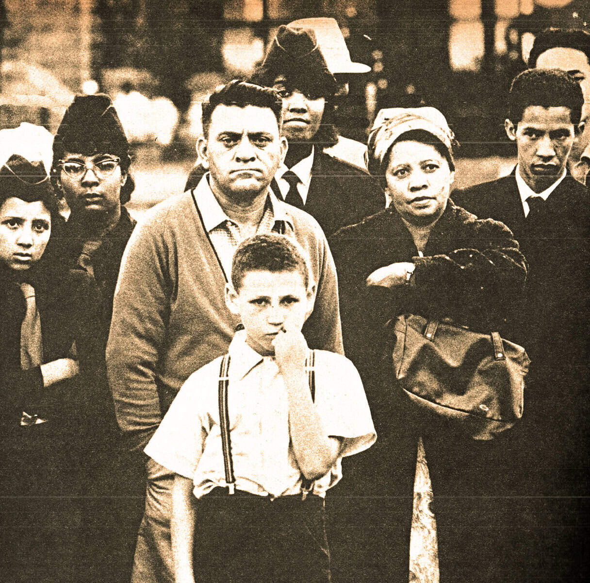 Historical Black and White Photo of Civil Rights Protestors, including a young boy and African American adults, emphasizing social justice, activism, and racial equality.