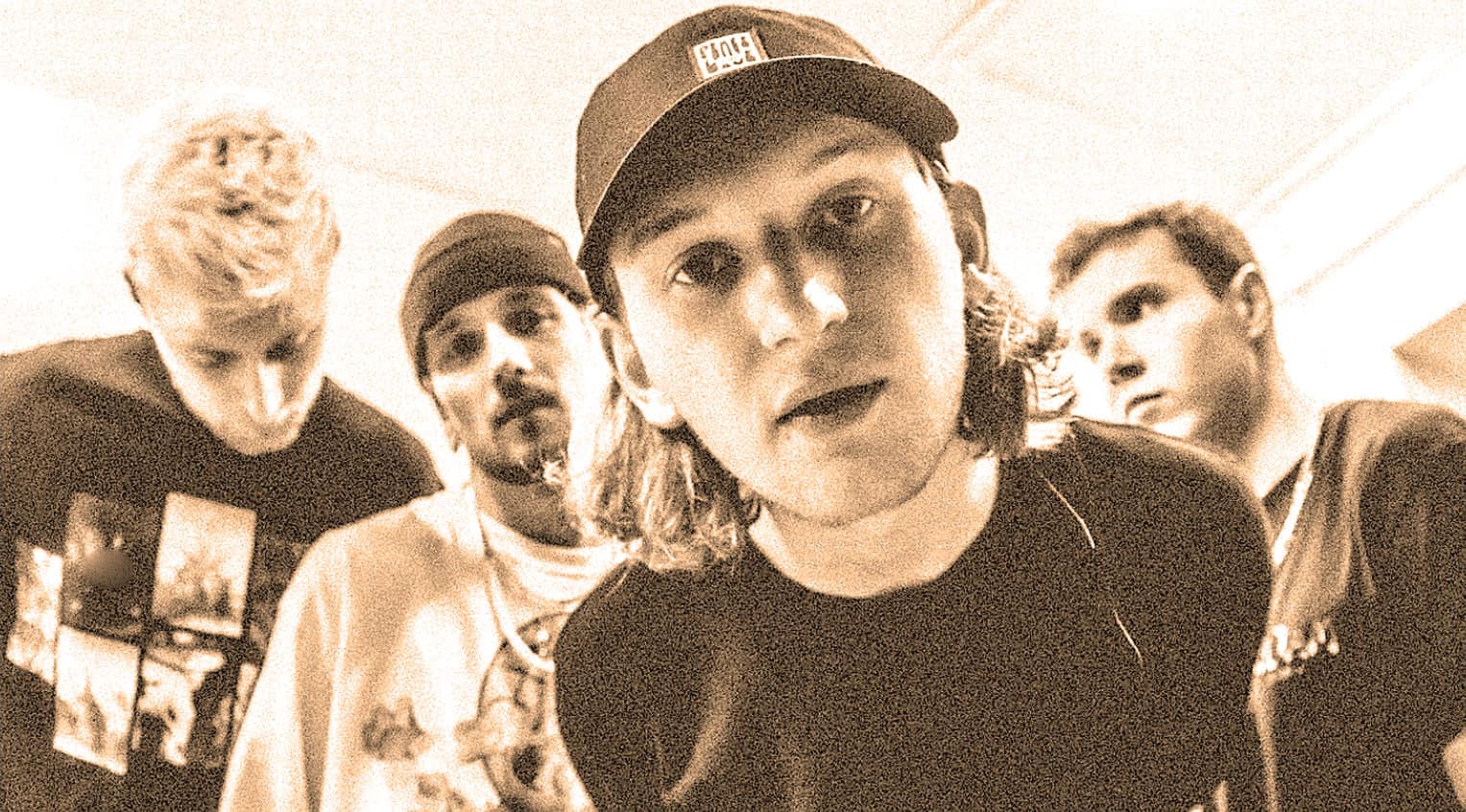 Young band members posing backstage at a music archive event at Past Daily, showcasing news, history, and music preservation.