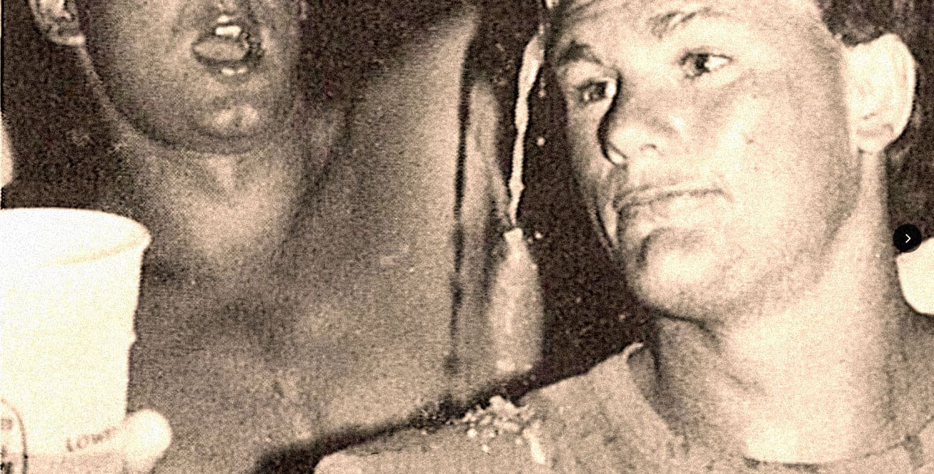 Close-up photograph of two women, one holding a cup, emphasizing historical and cultural significance, related to news, history, and music archives on Past Daily.