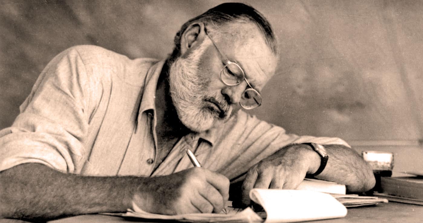 Contemporary journalist writing notes at desk, black and white photo, intellectual work, news archive, history documentation, media professional, Past Daily collection.