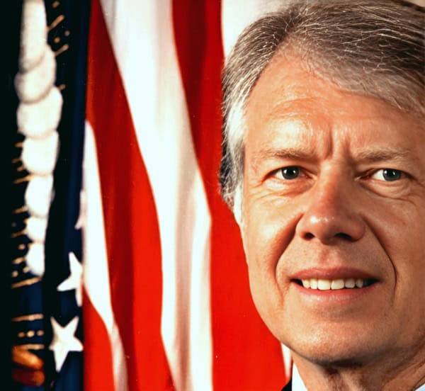 American politician with American flags in the background, close-up portrait for news, history, and music archives.