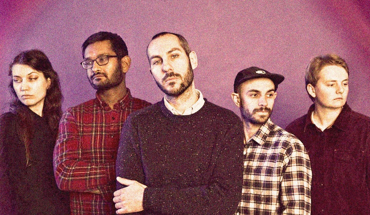 A Sound Archive of News, History, and Music Featuring a Band in Casual Attire for Nostalgic Audio Content.