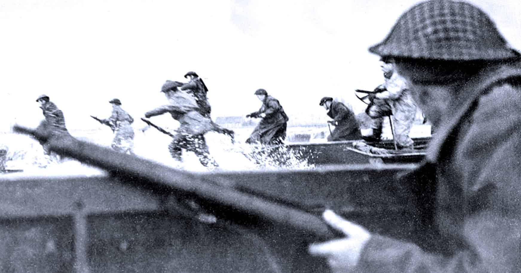 Soldiers running into action during World War II, black and white historical military photo, war, combat, soldiers in combat gear, armed conflict, historical war scene, military history, wartime photography, past daily archives.