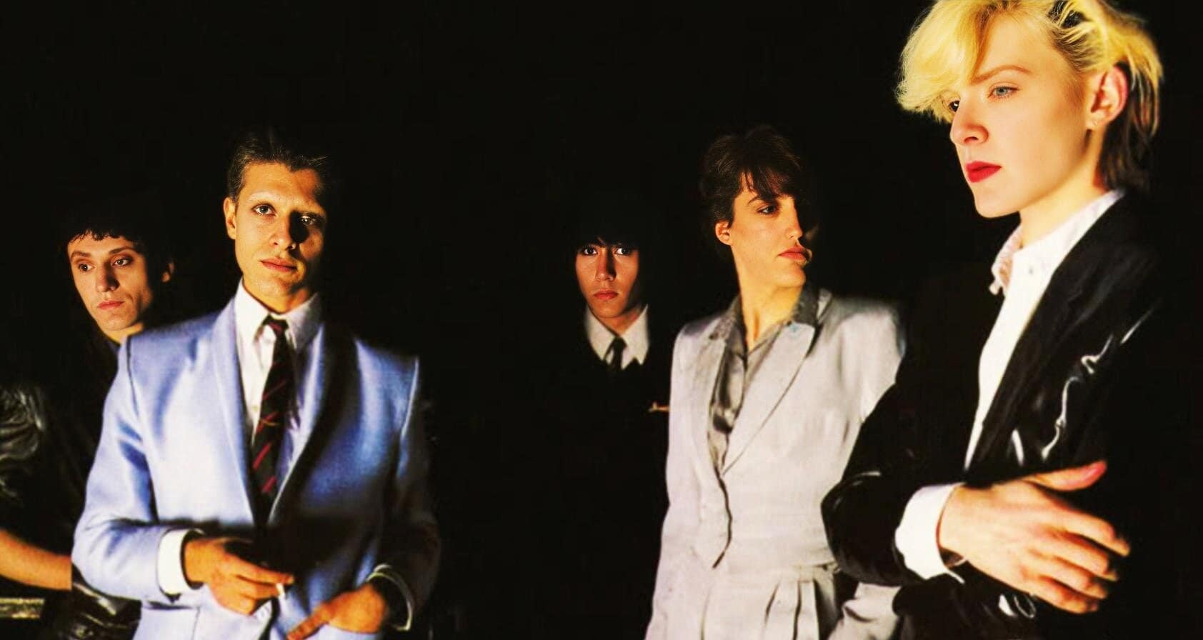 Ethereal post-punk band image with five members, showcasing 80s alternative rock style, reflective of music history and cultural influence, perfect for classic music archive websites.