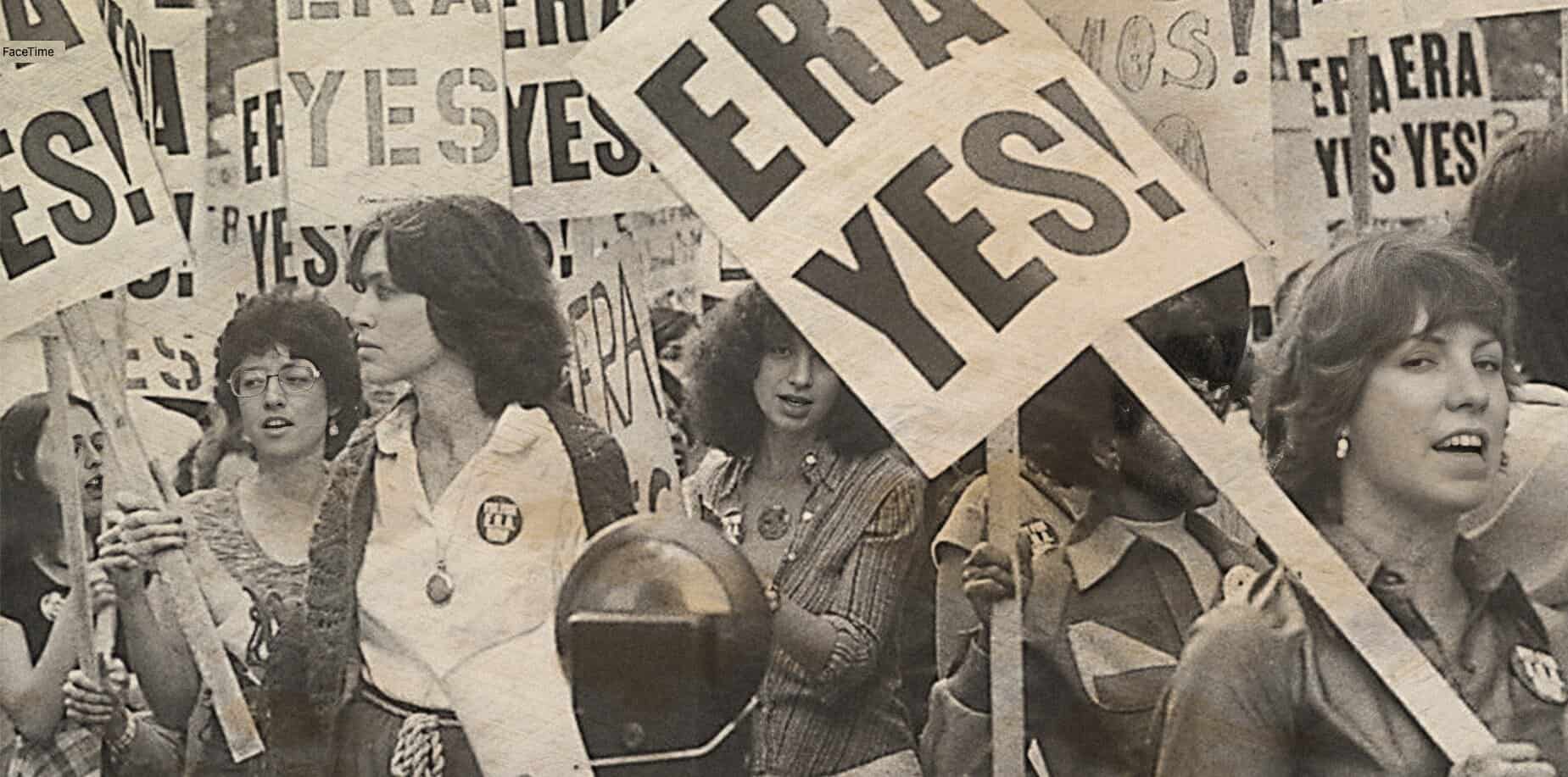 Women protesting with signs that say "YES!" and "YES!"; historic black and white photo emphasizing activism and social movements related to women's rights.