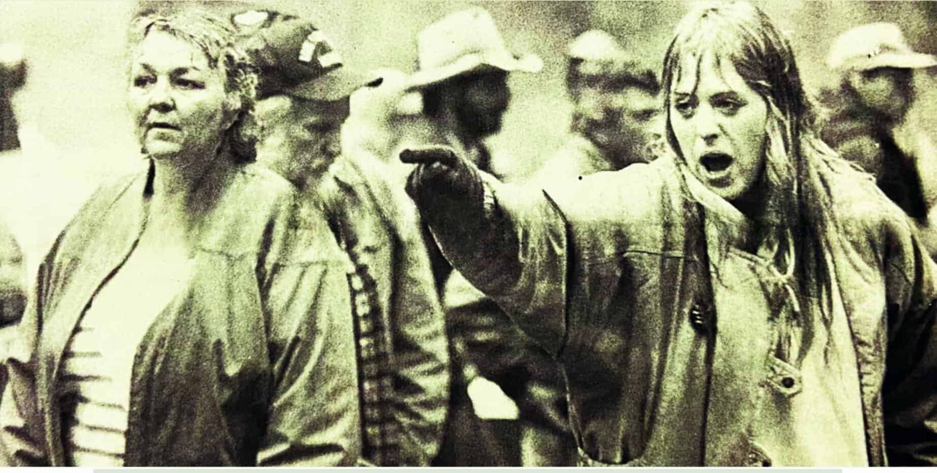 Vintage protest scene showing women activists passionately protesting, emphasizing social justice and civil rights, highlighting historic news, music, and cultural moments archived by Past Daily.