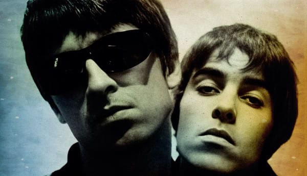 Vintage black and white photo of The Beatles, showcasing their iconic hairstyles and expressions, emphasizing music history and legendary rock bands.