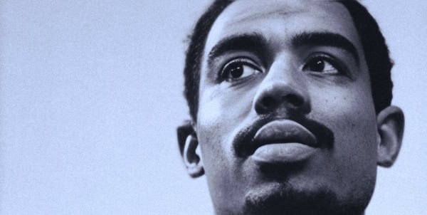 Historic black and white portrait of Martin Luther King Jr., a prominent leader in civil rights movement and iconic speaker on equality and justice.