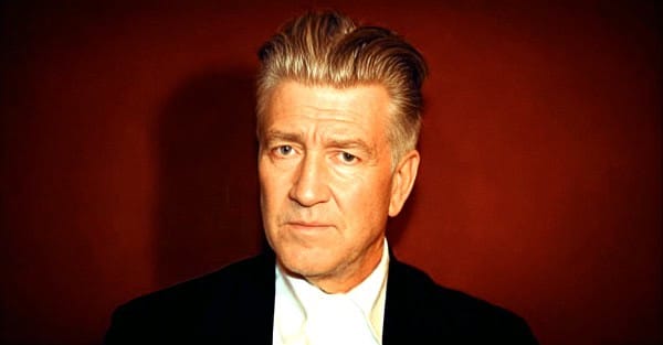 Vintage portrait of a sophisticated man with a serious expression, emphasizing historical news, music archives, and audio memorabilia from Past Daily.