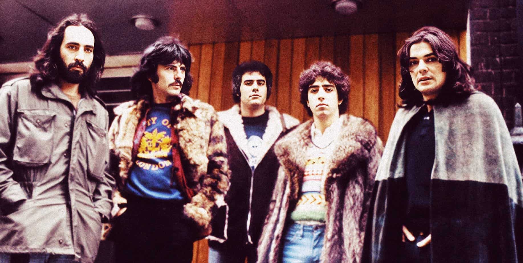 Vintage photo of The Beatles band members in a recording studio, showcasing iconic 1960s music history and music archive content for nostalgic and music history enthusiasts.